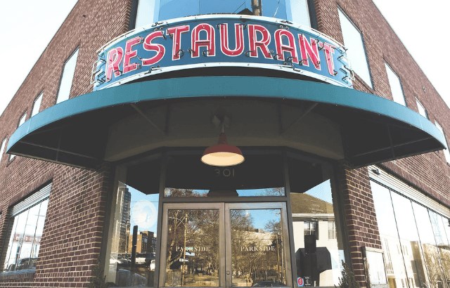 Restaurant sign on brick building